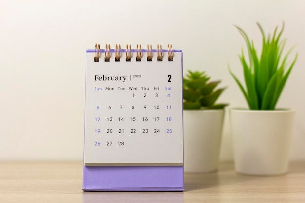 Premium Photo Desktop Calendar For February 2023 On A Light Background